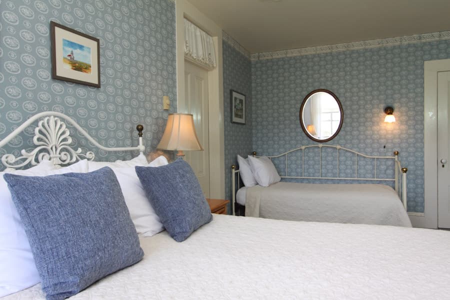 The Nautical room Queen bed with guest bed