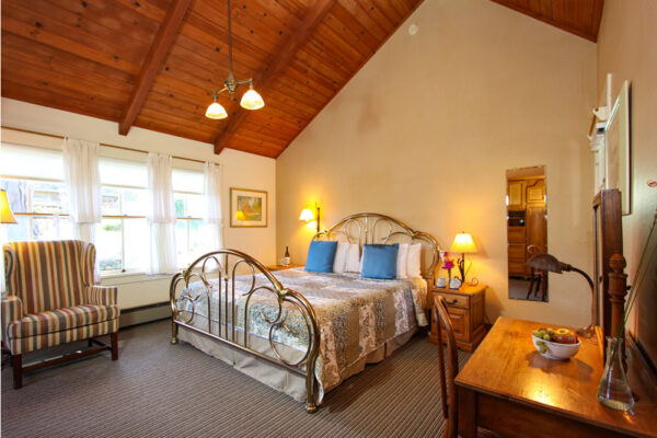 guestroom at joshua grindle inn mendocino with bed, desk and chair
