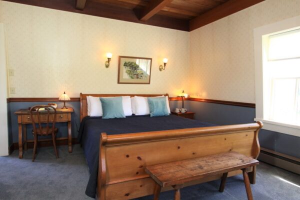 guestroom at joshua grindle inn mendocino with bed, dresser and chair